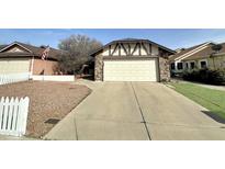 Charming single-Gathering home with a spacious two-car garage and concrete driveway at 10623 N 63Rd Dr, Glendale, AZ 85304