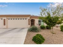 Charming single-story home featuring a two-car garage and desert landscaping at 10960 E Monte Ave # 199, Mesa, AZ 85209