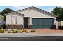 Charming single-story home featuring stone accents, a brick driveway, and a two-car garage at 3732 S 87Th Dr, Tolleson, AZ 85353