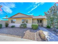 Charming single-story home featuring a well-maintained front yard with beautiful landscaping at 18835 N Palomar Dr, Sun City West, AZ 85375