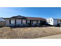 Charming single-story home featuring a low maintenance desert landscaped front yard and a two car garage at 5401 W Sierra St, Glendale, AZ 85304