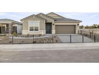 Charming single-story home with a well-maintained front yard and inviting curb appeal at 9998 N 178Th Dr, Waddell, AZ 85355