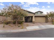 Charming single-Gathering home featuring a desert landscape and a two-car garage at 1432 E Pedro Rd, Phoenix, AZ 85042