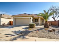 Charming single-Gathering home with a well-maintained front yard and attached two-car garage at 16875 W Manchester Dr, Surprise, AZ 85374