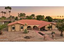 Expansive single-story home featuring a red tile roof, desert landscaping, and charming walkway at 2107 E Inca St, Mesa, AZ 85213