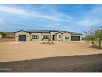 Stunning single-story home with desert landscaping and a modern design featuring a neutral color palette at 39705 N 3Rd St, Phoenix, AZ 85086