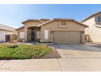 Lovely single-story home showcasing well-maintained landscaping and a charming front entrance at 4881 W Flint St, Chandler, AZ 85226