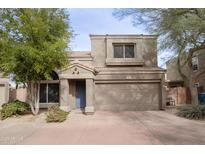 Charming two-story home with a well-maintained front yard, covered entry, and large attached garage at 17606 N 17Th Pl # 1006, Phoenix, AZ 85022