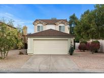 Charming two-story home with a well-maintained lawn and a two-car garage at 1811 S 39Th St # 30, Mesa, AZ 85206