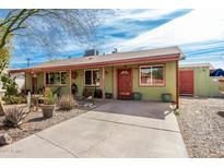 Charming single-story home featuring a well-maintained yard and a cozy, inviting entrance at 2925 W Highland Ave, Phoenix, AZ 85017