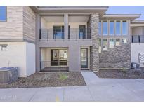 Contemporary home with multiple balconies, modern stone accents, and manicured landscaping offering curb appeal at 2121 W Sonoran Desert Dr # 45, Phoenix, AZ 85085