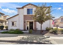 Charming two-story home with stone accents, desert landscaping, and a welcoming front entrance at 5337 W Marcus Dr, Phoenix, AZ 85083