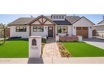 Charming home featuring a walkway, manicured landscaping, and welcoming front yard at 7525 E Latham St, Scottsdale, AZ 85257