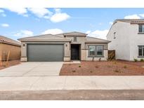 Charming single-story home featuring a two-car garage and well-maintained front yard at 25179 W Atlanta Ave, Buckeye, AZ 85326