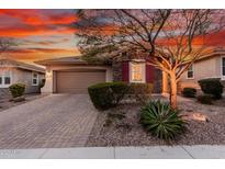 Charming single-story home with stone accents, desert landscaping, and a two-car garage at 30816 N 138Th Ave, Peoria, AZ 85383