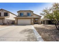 Inviting two-story home featuring a spacious driveway and charming curb appeal in a desirable neighborhood at 4439 E Coyote Wash Dr, Cave Creek, AZ 85331
