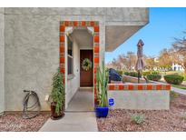 Inviting front entrance features a decorative tiled archway and charming wooden door with a wreath at 1724 E Bridgeport Pkwy, Gilbert, AZ 85295