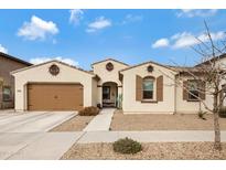 Charming single-story home featuring a two-car garage, desert landscaping, and a welcoming front porch at 22854 E Sonoqui Blvd, Queen Creek, AZ 85142