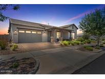 Charming single-Gathering home with a well-manicured front yard and a two-car garage at sunset at 4330 S Neutron --, Mesa, AZ 85212