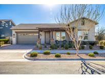 Charming single-story home featuring a well-manicured front yard, desert landscaping, and a two-car garage at 4330 S Neutron --, Mesa, AZ 85212