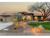 Charming home with a beautifully landscaped yard and inviting entrance at 10105 E Larkspur Dr, Scottsdale, AZ 85260