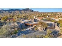Stunning desert home featuring mountain views, unique architecture, and beautiful landscaping at 40915 N 107Th Pl, Scottsdale, AZ 85262