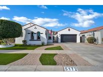 Charming single-story home with desert landscaping, a spacious driveway, and a welcoming facade at 5172 S Seton Ave, Gilbert, AZ 85298