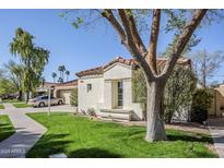 Charming single-story home featuring a red tile roof, stucco siding, and a well-maintained front yard at 11840 N 40Th Way, Phoenix, AZ 85028