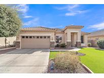 Inviting single-story home with well-maintained front yard and stone accents at 16847 W Marconi Ave, Surprise, AZ 85388