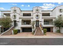 Stunning three-story townhome featuring a private garage, balconies and traditional architecture at 17773 N 77Th Way, Scottsdale, AZ 85255