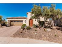 Charming single-story home with a well-manicured front yard, desert landscaping and a two car garage at 28798 N 127Th Ave, Peoria, AZ 85383