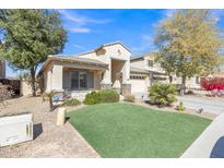 Charming single-Gathering home featuring well-manicured lawn and desert landscaping for low maintenance at 2910 E Quiet Hollow Ln, Phoenix, AZ 85024