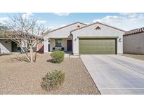Charming single-story home features a well-maintained yard and an attached two-car garage at 45734 W Sky Ln, Maricopa, AZ 85139
