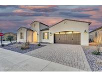 Charming home with a spacious driveway, a two-car garage, and well-maintained landscaping at 500 E Watermelon Ln, Queen Creek, AZ 85140