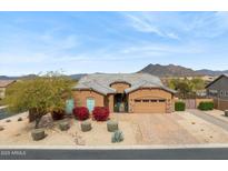 Charming single-story home with desert landscaping, beautiful flowers and mountain views at 6208 E Lonesome Trl, Cave Creek, AZ 85331