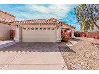 Charming single-Gathering home featuring a two-car garage with a well-maintained front yard and beautiful shrubbery at 819 E Audrey Ln, Phoenix, AZ 85022