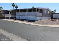 Charming single-story home with shaded carport and minimal landscaping at 9501 E Broadway Rd # 237, Mesa, AZ 85208