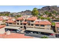 Beautiful multi-level condo with covered parking, set against a backdrop of majestic mountains at 10410 N Cave Creek Rd # 2034, Phoenix, AZ 85020