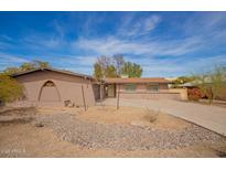 Charming single-story home featuring desert landscaping and a concrete driveway leading to the entrance at 2142 E Palmcroft Dr, Tempe, AZ 85282