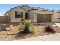 Charming single-story home featuring a two car garage and low maintenance desert landscaping at 29909 N Yucca Dr, Florence, AZ 85132