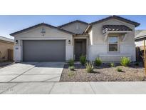 Charming single-story home with a two-car garage, desert landscaping, and neutral stucco facade at 31400 N 130Th Ave, Peoria, AZ 85383