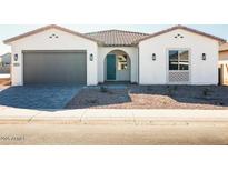 Charming single-story home with a grey garage door, turquoise front door, and modern desert landscaping at 3951 E Gold Mountain Ave, San Tan Valley, AZ 85143