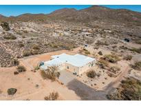 Expansive desert property featuring a modern home with a spacious driveway and beautiful mountain views at 50408 N 22Nd Ave, New River, AZ 85087