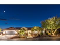 Charming single-story home with well-lit landscaping and a two-car garage at 5904 E Calle De Las Estrellas Rd, Cave Creek, AZ 85331