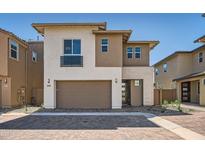 Beautiful two-story home featuring a two-car garage, desert landscaping, and a modern design at 10209 E Ursula Ave, Mesa, AZ 85212