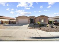 Charming single-story home with desert landscaping and a two-car garage in a quiet neighborhood at 1101 W Oleander Ave, Queen Creek, AZ 85140