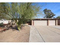 Charming single-story home with a low maintenance front yard and two-car garage at 19013 N 18Th Ave, Phoenix, AZ 85027