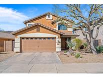 Two-story home with a two-car garage and desert landscaping in front and clear blue sky at 2168 E Vista Bonita Dr, Phoenix, AZ 85024