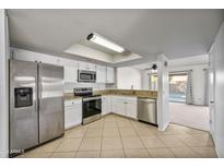 Bright kitchen featuring stainless steel appliances and granite countertops at 2706 W Estrella Dr, Chandler, AZ 85224