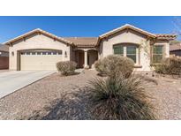 Charming single-story home with desert landscaping and a two-car garage, showcasing its inviting curb appeal at 3034 E Coconino Dr, Gilbert, AZ 85298